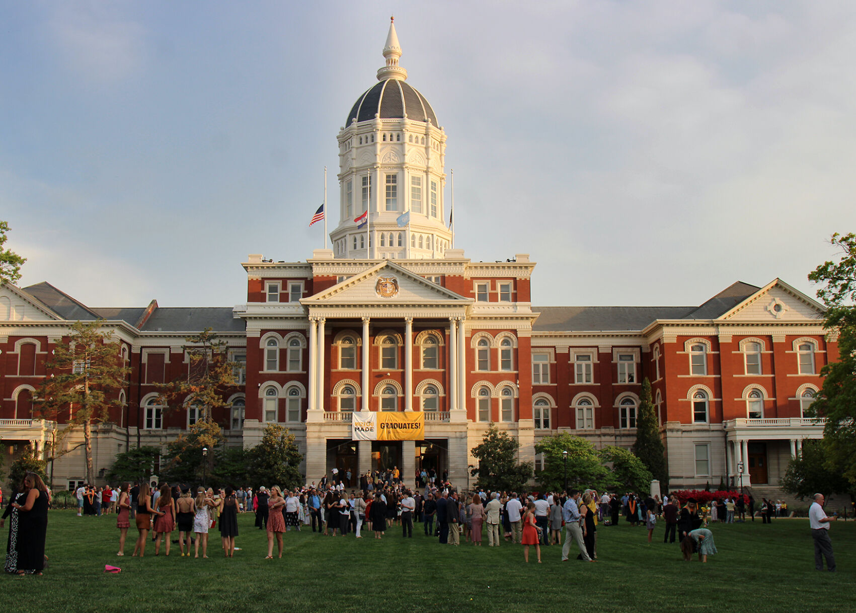 Graduates gather with their families and friends between ceremonies